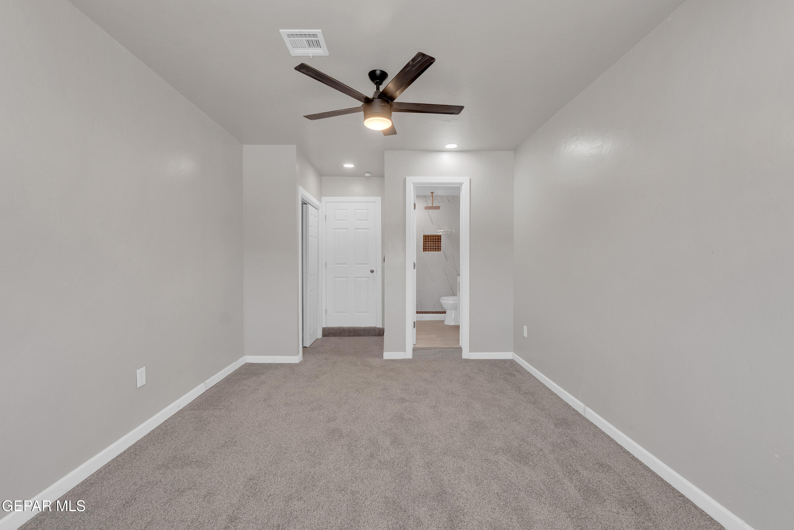 10141 Alcan Street El Paso, TX 79924 - Photo 27 of 49 an empty room with ceiling fan and window