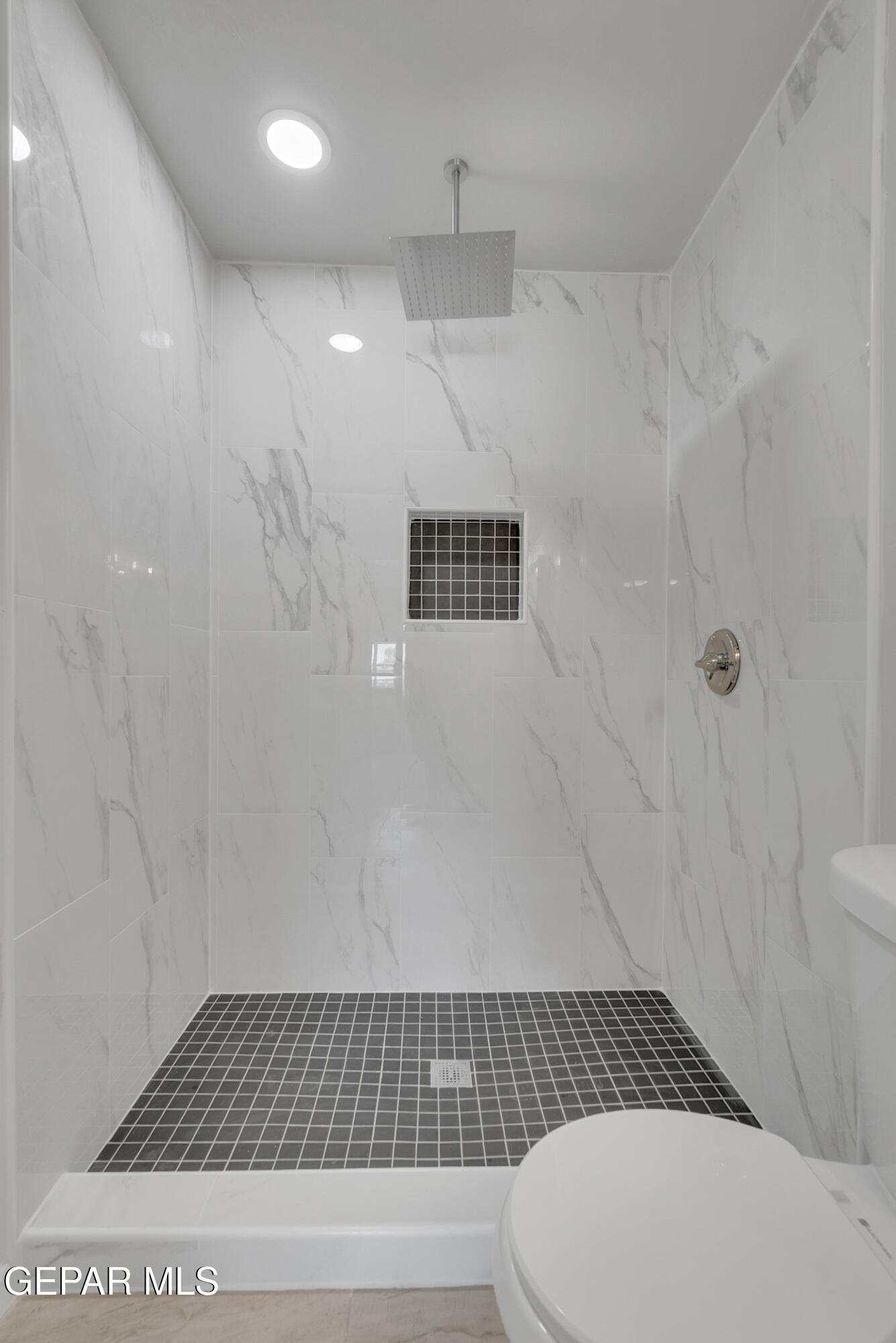 10141 Alcan Street El Paso, TX 79924 - Photo 29 of 49 a bathroom with a shower