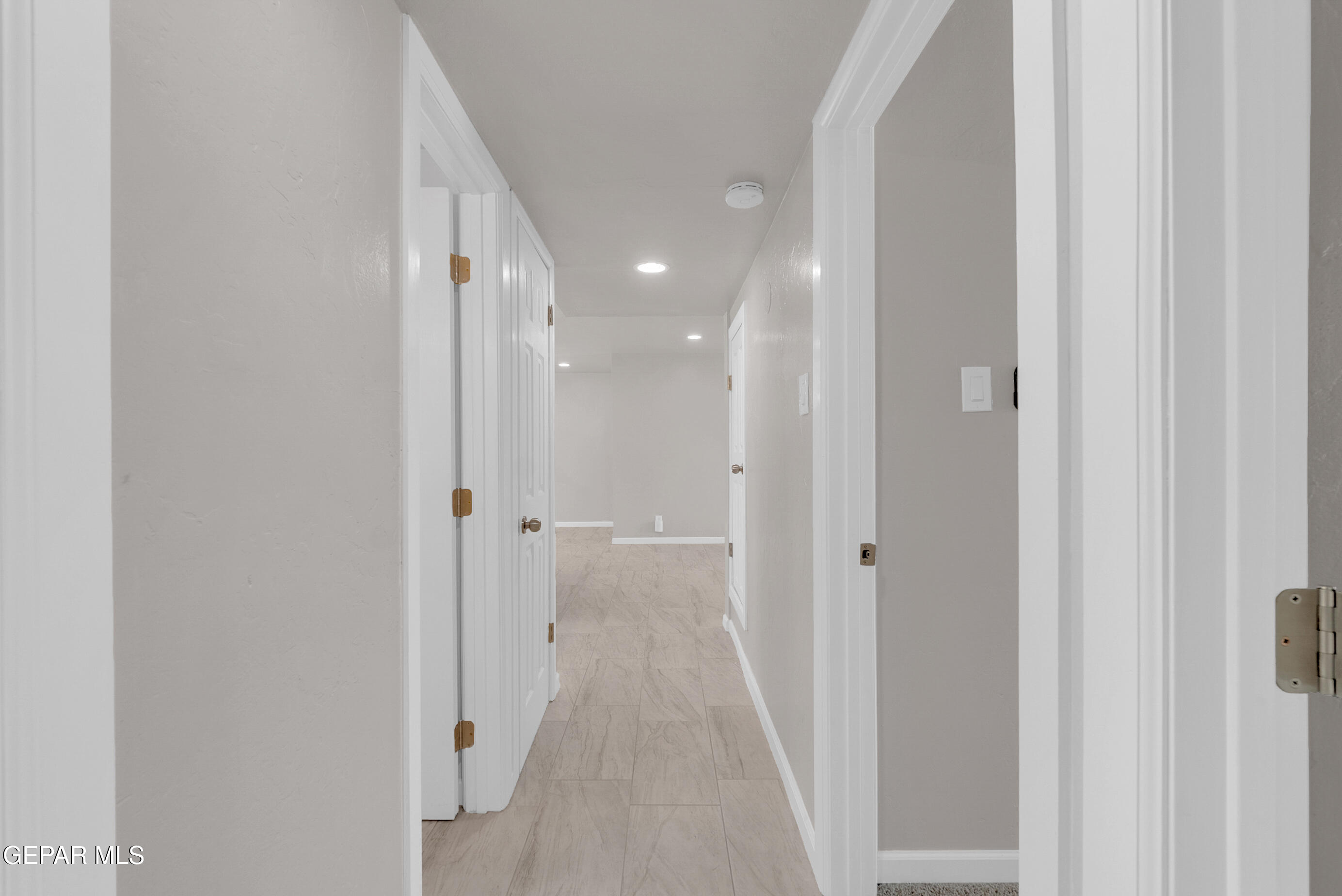10141 Alcan Street El Paso, TX 79924 - Photo 35 of 49 a view of a hallway with wooden floor