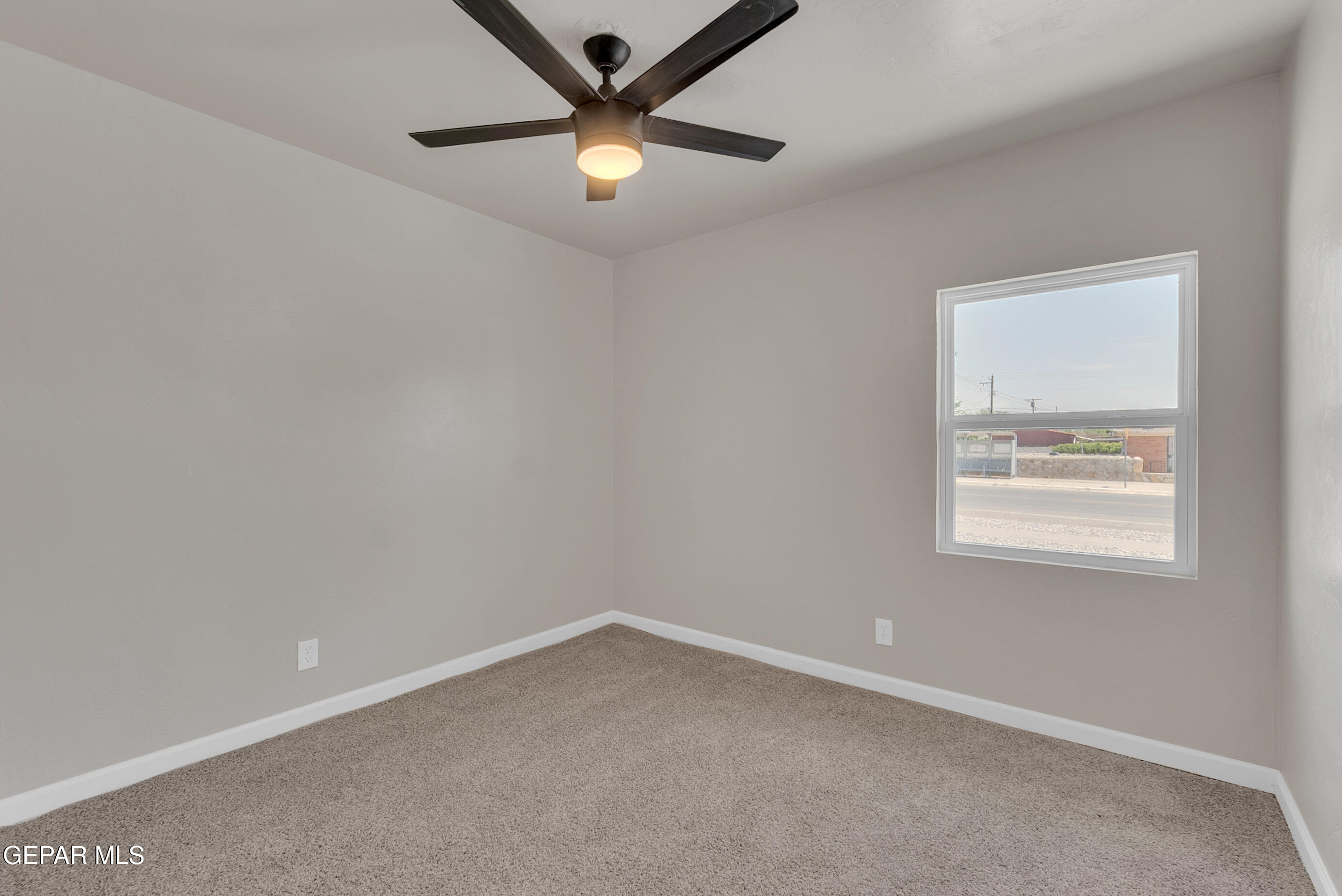 10141 Alcan Street El Paso, TX 79924 - Photo 36 of 49 an empty room with a window and a fan