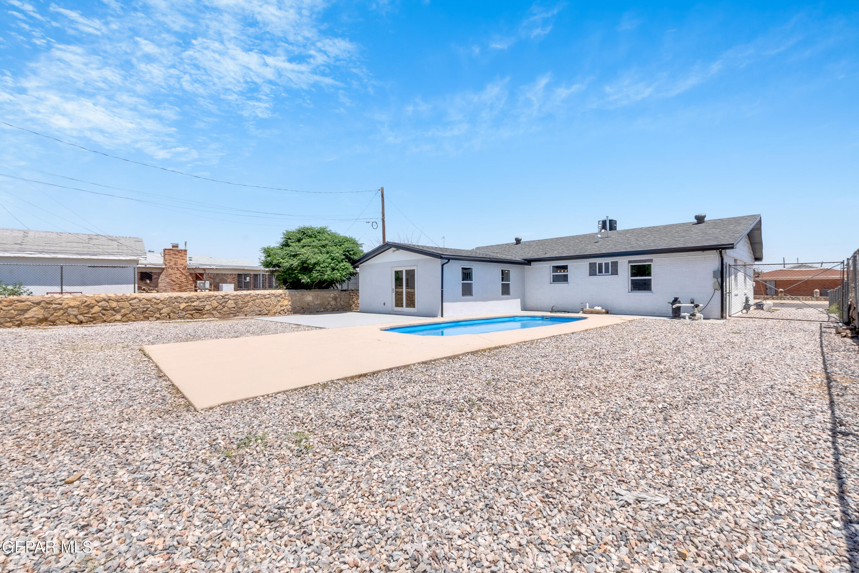 10141 Alcan Street El Paso, TX 79924 - Photo 48 of 49 a front view of a house with a yard