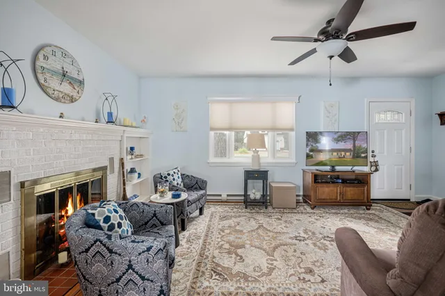 a view of a dining room with furniture and a window