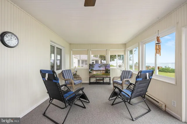 a view of a lake with houses in back