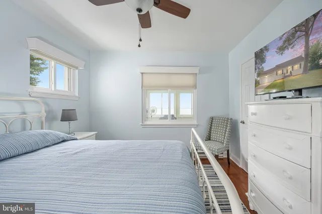 a view of a table and chairs in backyard of the house