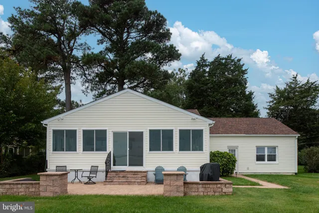 a view of a swimming pool with a bench and a couch