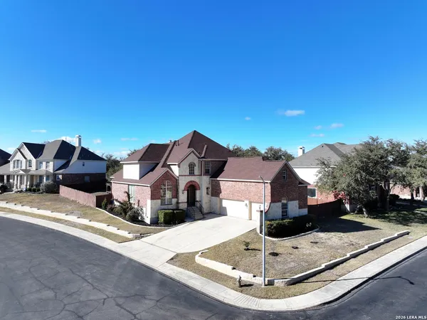 an aerial view of a house with outdoor space
