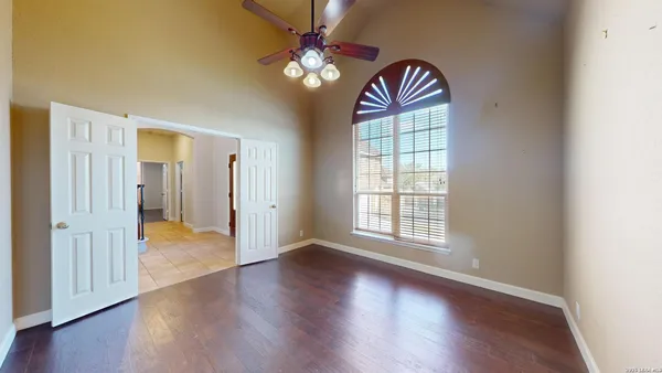 a view of a kitchen with a fireplace and wooden floor