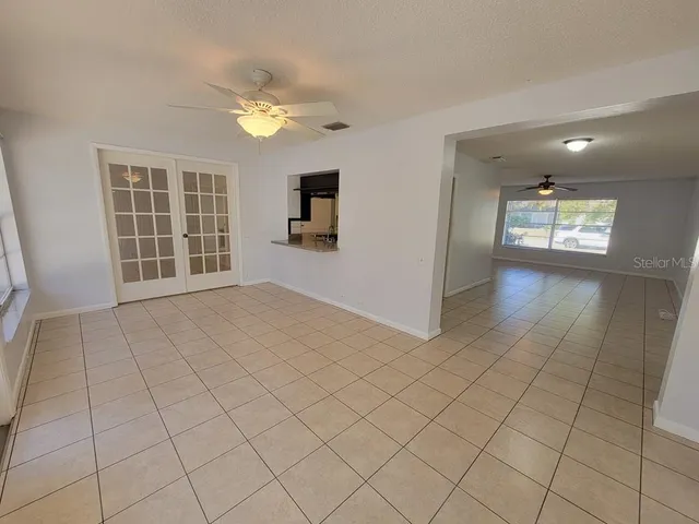a view of an empty room with a window