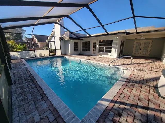 a view of a backyard with sitting area