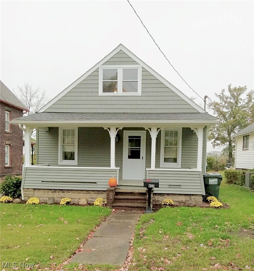 813 Cherry Road Northwest Massillon, OH 44647 - Photo 1 of 19 Bungalow-style home with a front yard and covered porch