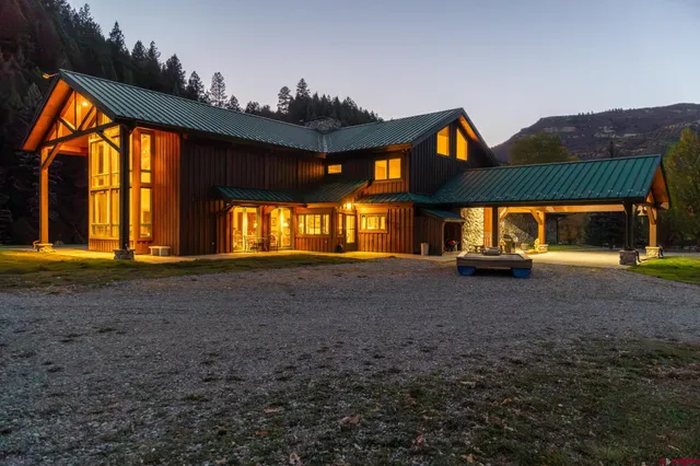 a view of house with backyard and deck