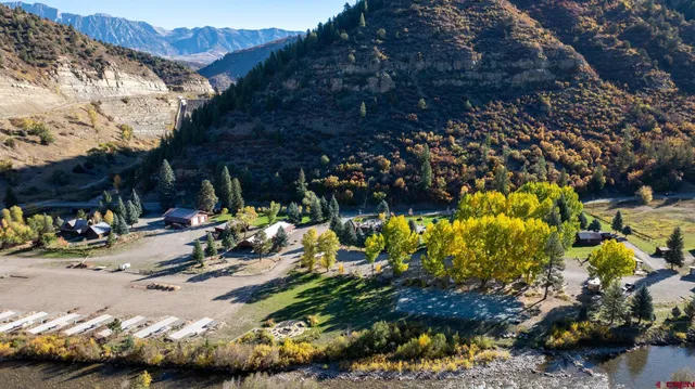 a view of swimming pool with an outdoor seating