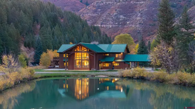 a swimming pool view with a lake view