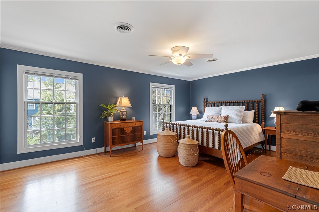 300 North Ridge Road, Unit 33 Henrico, VA 23229 - Photo 28 of 40 a bedroom with a bed and wooden floor