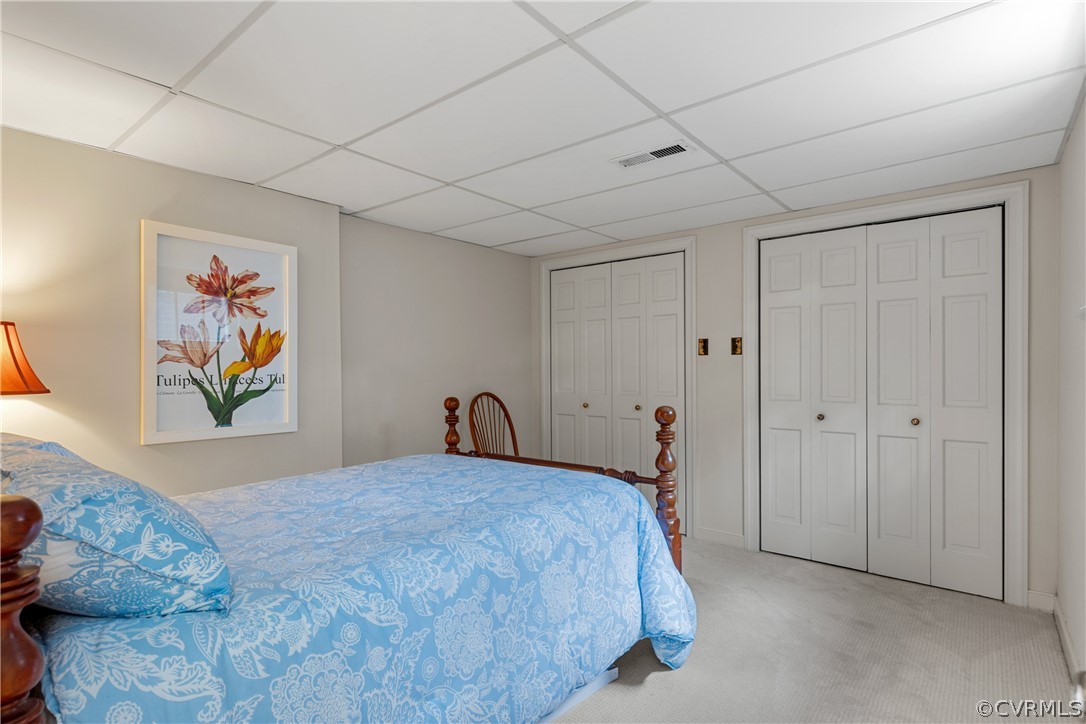 300 North Ridge Road, Unit 33 Henrico, VA 23229 - Photo 36 of 40 a bedroom with a bed and a painting on the wall