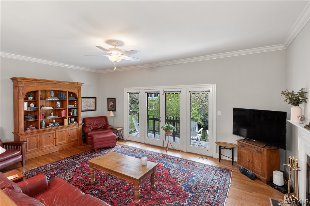 300 North Ridge Road, Unit 33 Henrico, VA 23229 - Photo 6 of 40 a living room with furniture a flat screen tv and a floor to ceiling window