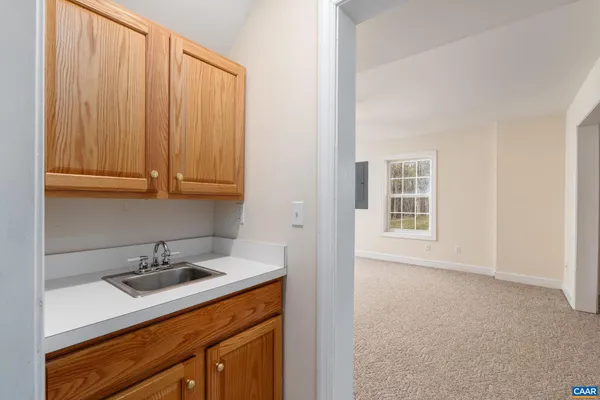 a sink storage and utility room with granite countertop a sink
