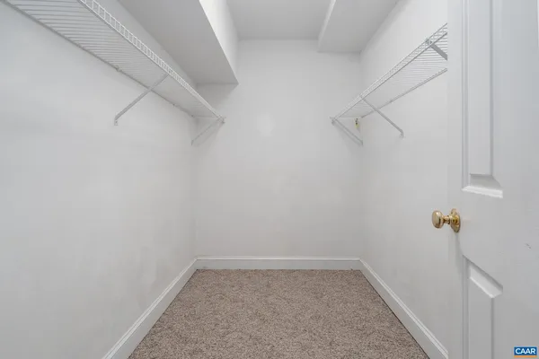 a view of a room with racks on the wall