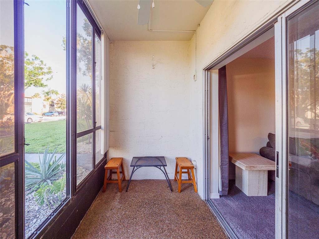 3235 South Beneva Road, Unit 101 Sarasota, FL 34232 - Photo 11 of 36 a living room with a large window