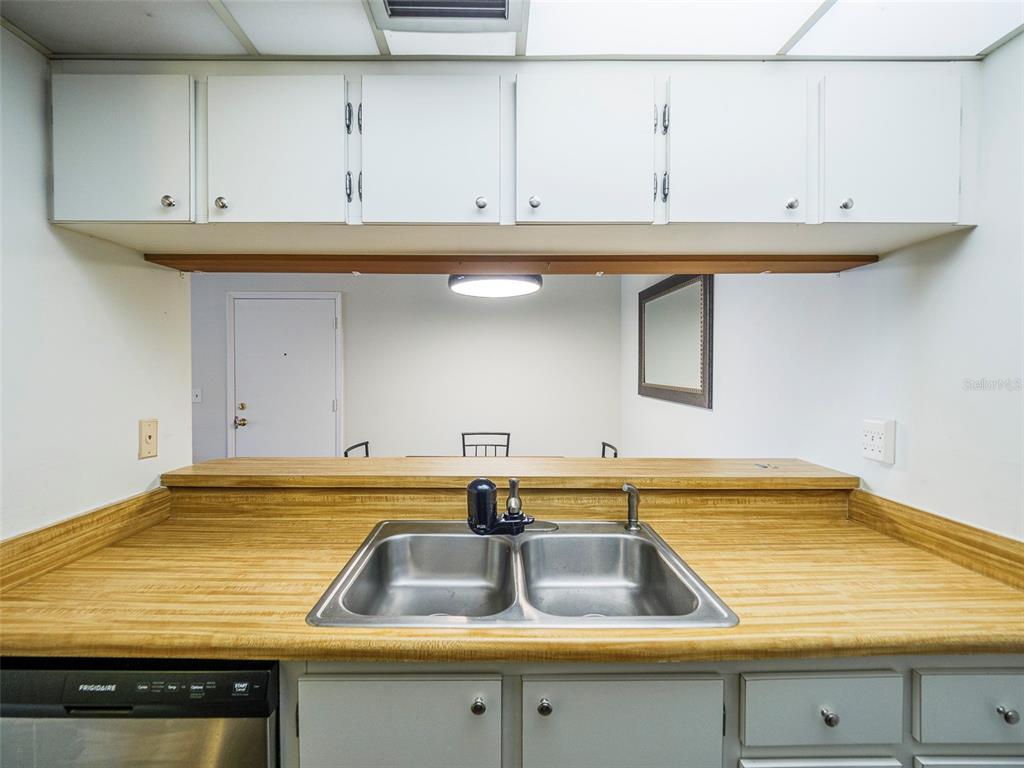 3235 South Beneva Road, Unit 101 Sarasota, FL 34232 - Photo 16 of 36 a view of a sink with kitchen island