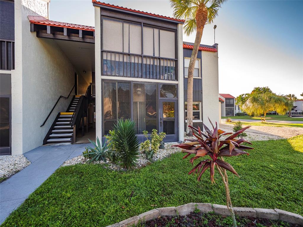 3235 South Beneva Road, Unit 101 Sarasota, FL 34232 - Photo 31 of 36 a view of a house with a yard