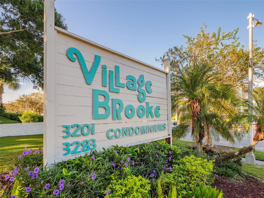 3235 South Beneva Road, Unit 101 Sarasota, FL 34232 - Photo 34 of 36 a sign that is on a wooden wall