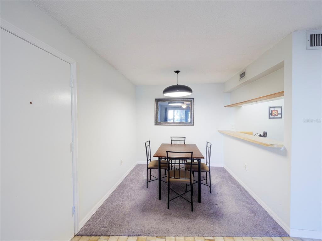 3235 South Beneva Road, Unit 101 Sarasota, FL 34232 - Photo 5 of 36 a view of a dining room with furniture