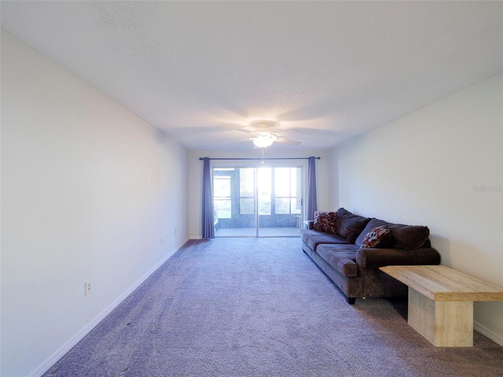 3235 South Beneva Road, Unit 101 Sarasota, FL 34232 - Photo 6 of 36 a living room with furniture and a window