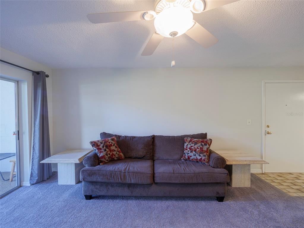 3235 South Beneva Road, Unit 101 Sarasota, FL 34232 - Photo 7 of 36 a living room with a couch