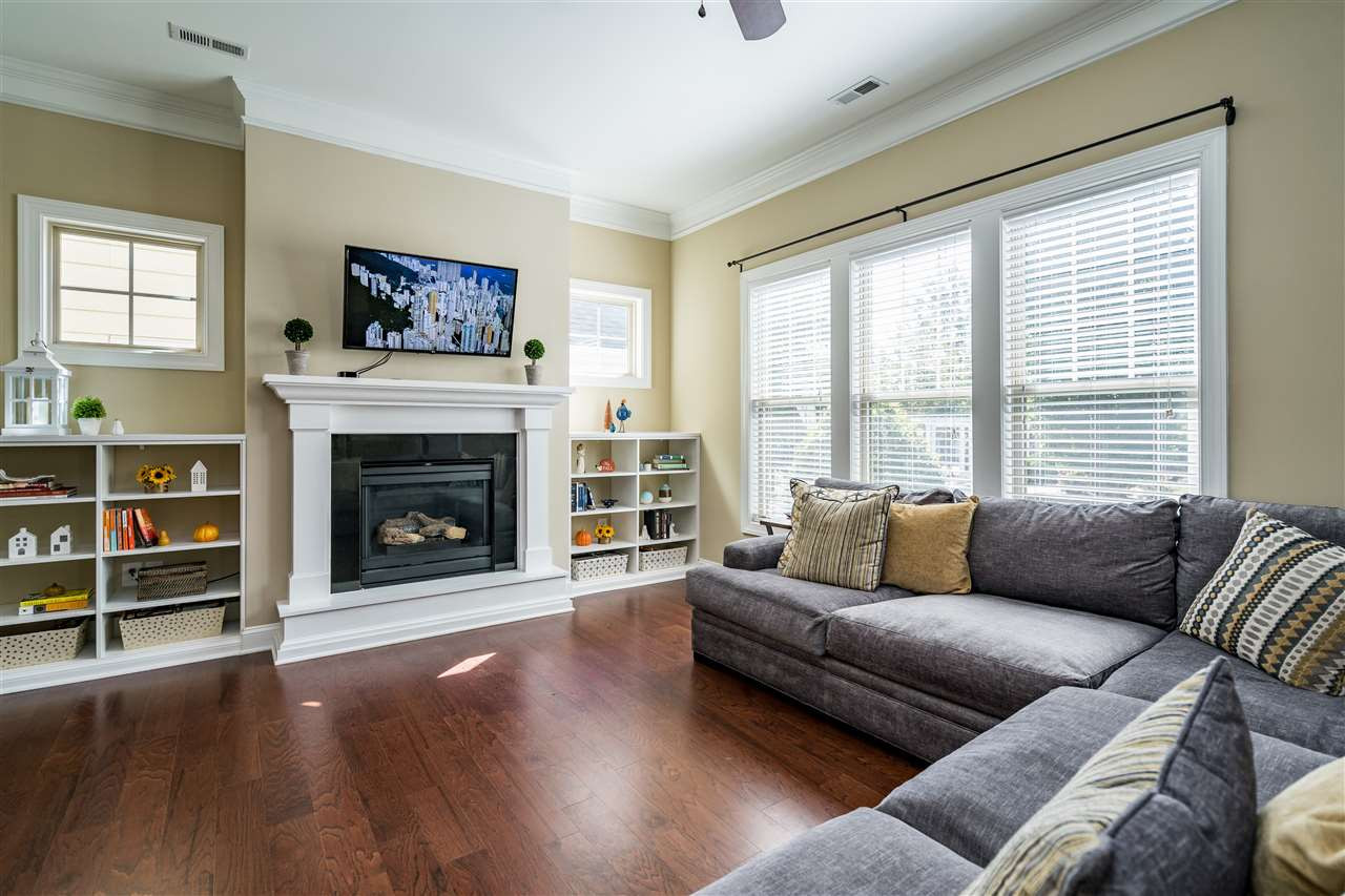 1411 Van Page Boulevard Raleigh, NC 27607 - Photo 6 of 26 Light filled living room with built in bookshelves, gas fireplace, ceiling fan and open floorpan! Living Room