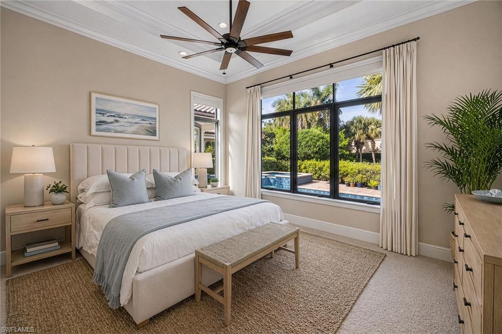 2277 Residence Circle Naples, FL 34105 - Photo 15 of 41 a bedroom with a large bed and a window