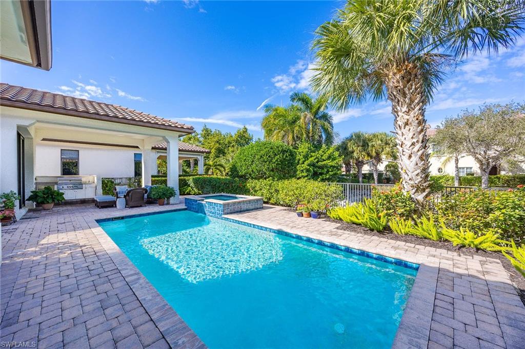 2277 Residence Circle Naples, FL 34105 - Photo 2 of 50 a view of swimming pool with a patio