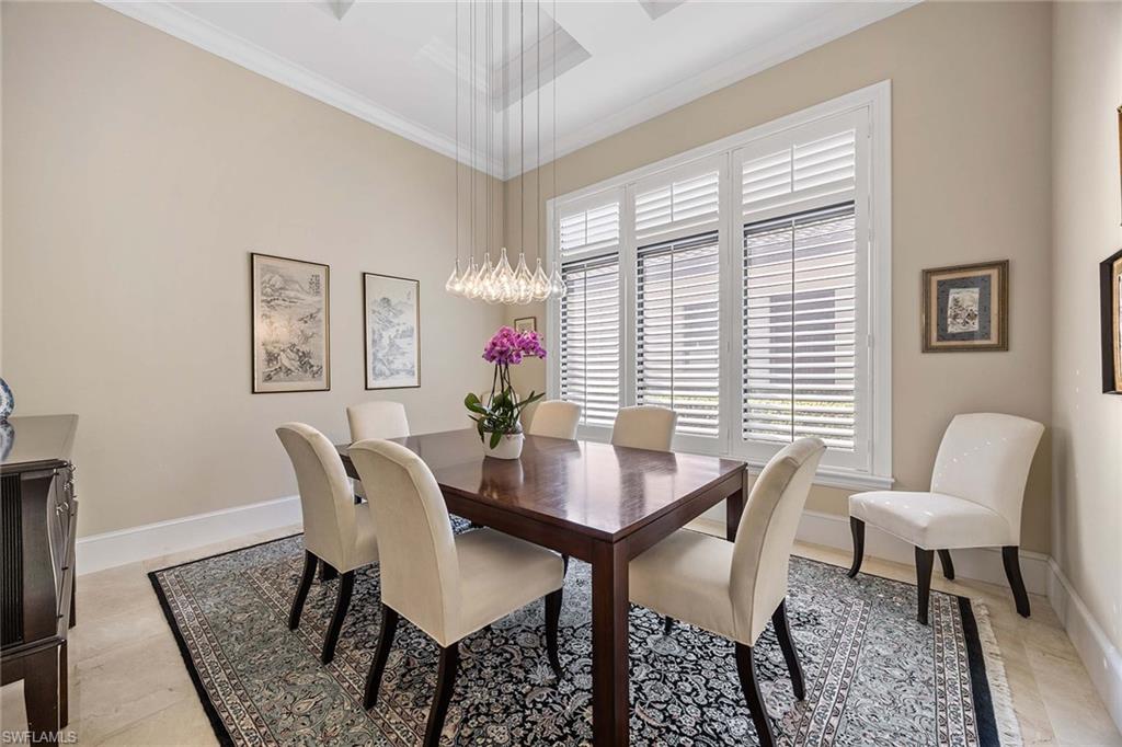 2277 Residence Circle Naples, FL 34105 - Photo 24 of 50 a view of a dining room with furniture and a large window