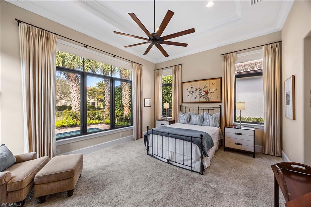 2277 Residence Circle Naples, FL 34105 - Photo 25 of 41 a bed room with a bed and a large window