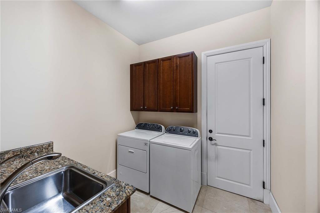 2277 Residence Circle Naples, FL 34105 - Photo 26 of 50 a room with storage and utility