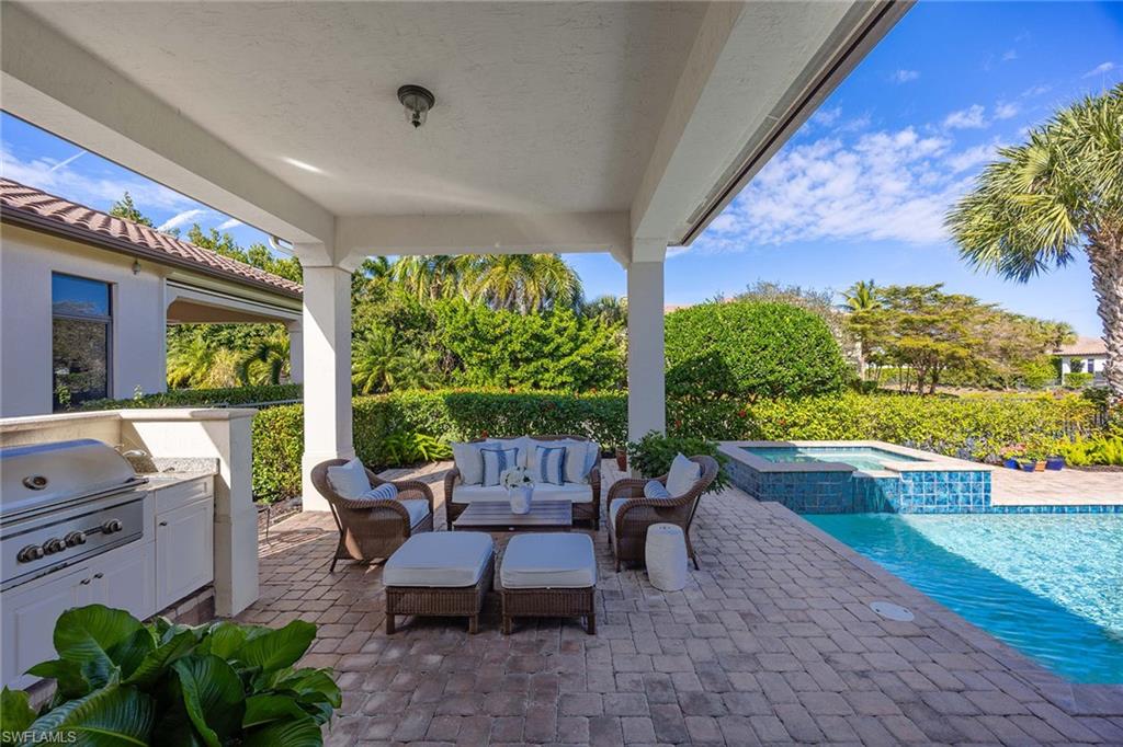 2277 Residence Circle Naples, FL 34105 - Photo 27 of 50 a balcony with furniture and garden view