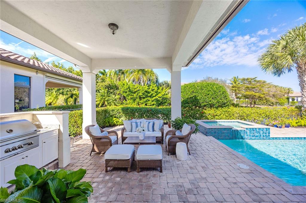 2277 Residence Circle Naples, FL 34105 - Photo 3 of 41 a building outdoor space with patio furniture and potted plants