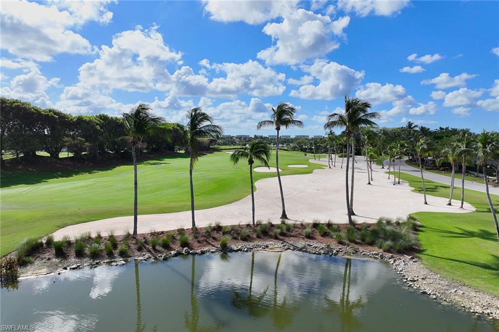 2277 Residence Circle Naples, FL 34105 - Photo 37 of 41 a view of a lake with a house