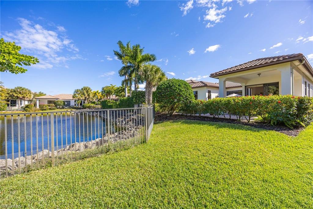 2277 Residence Circle Naples, FL 34105 - Photo 8 of 41 a view of a house with a swimming pool