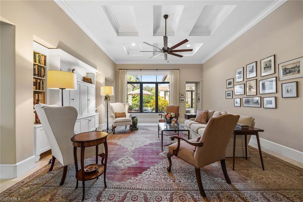 2277 Residence Circle Naples, FL 34105 - Photo 8 of 50 a living room with furniture a chandelier and a window