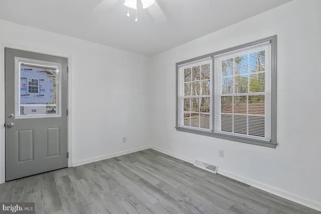 a kitchen with a refrigerator and a stove