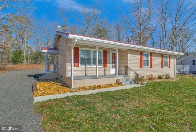 a house with trees in front of it