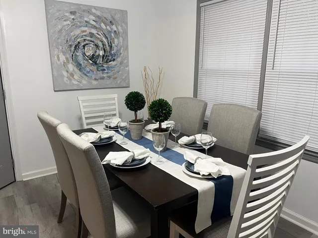 a kitchen with granite countertop a stove sink and cabinets