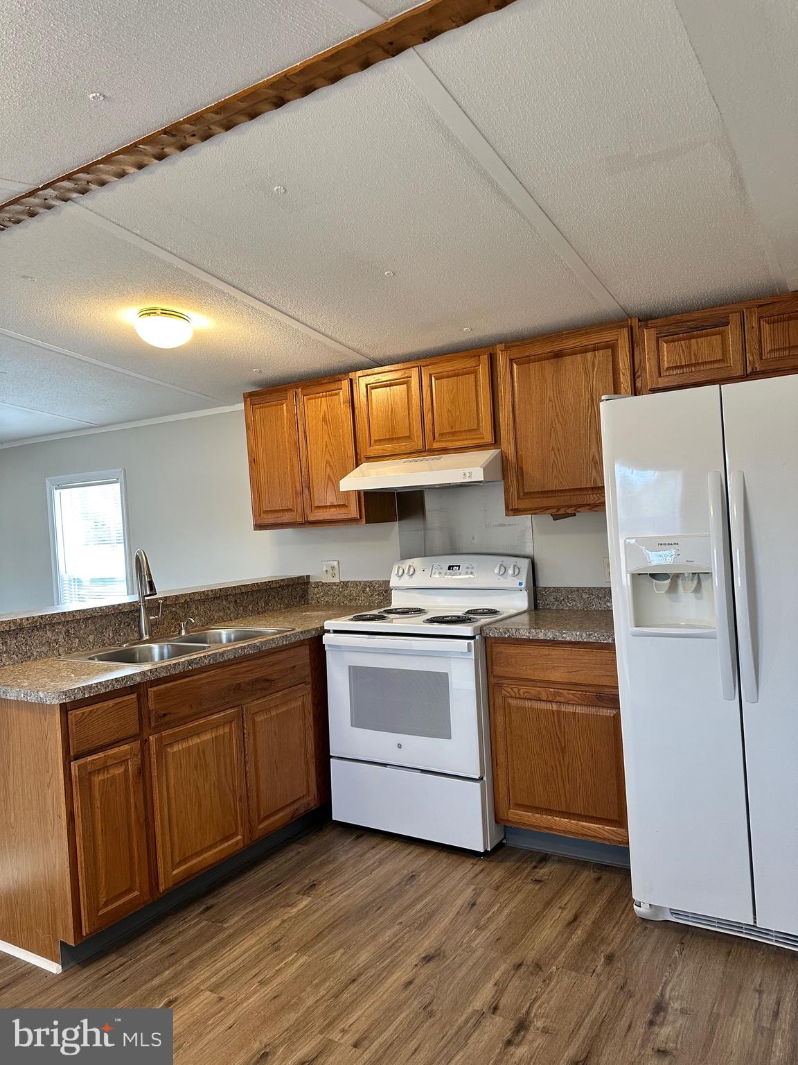 16335 Abbotts Pond Road Milford, DE 19963 - Photo 14 of 18 a kitchen with stainless steel appliances granite countertop a sink and cabinets