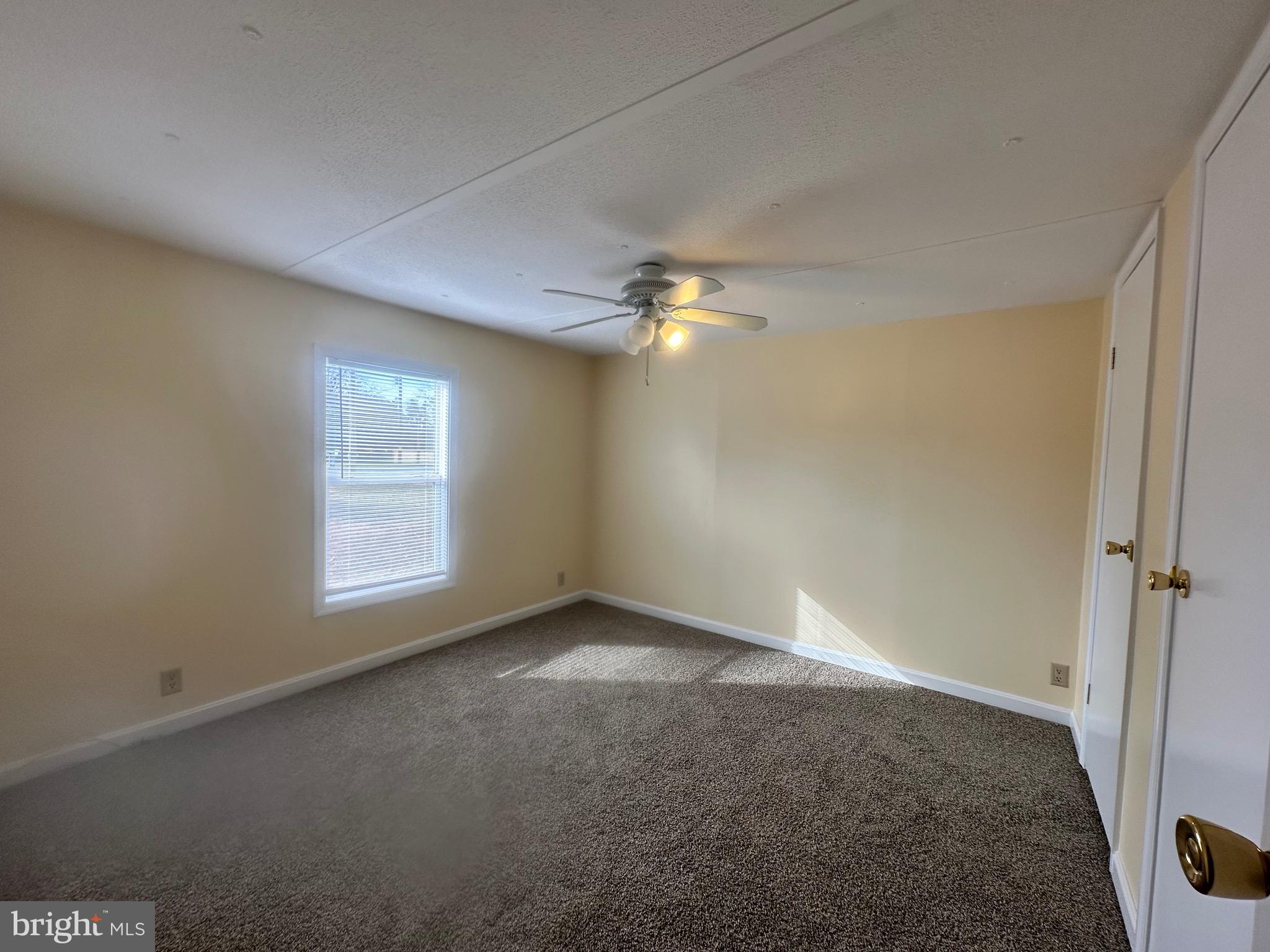 16335 Abbotts Pond Road Milford, DE 19963 - Photo 18 of 18 a view of an empty room with a window