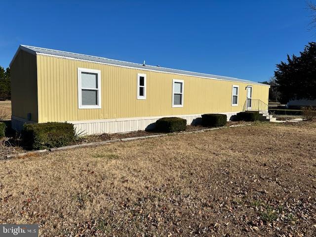 16335 Abbotts Pond Road Milford, DE 19963 - Photo 2 of 18 a black and white house with a yard