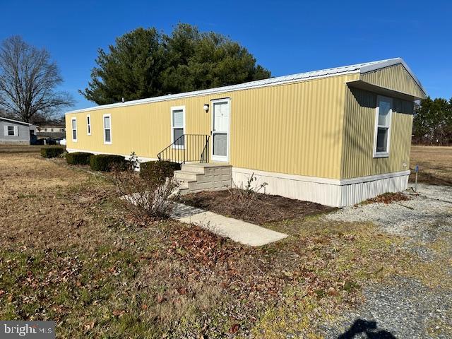 16335 Abbotts Pond Road Milford, DE 19963 - Photo 7 of 18 a view of a white house with a yard