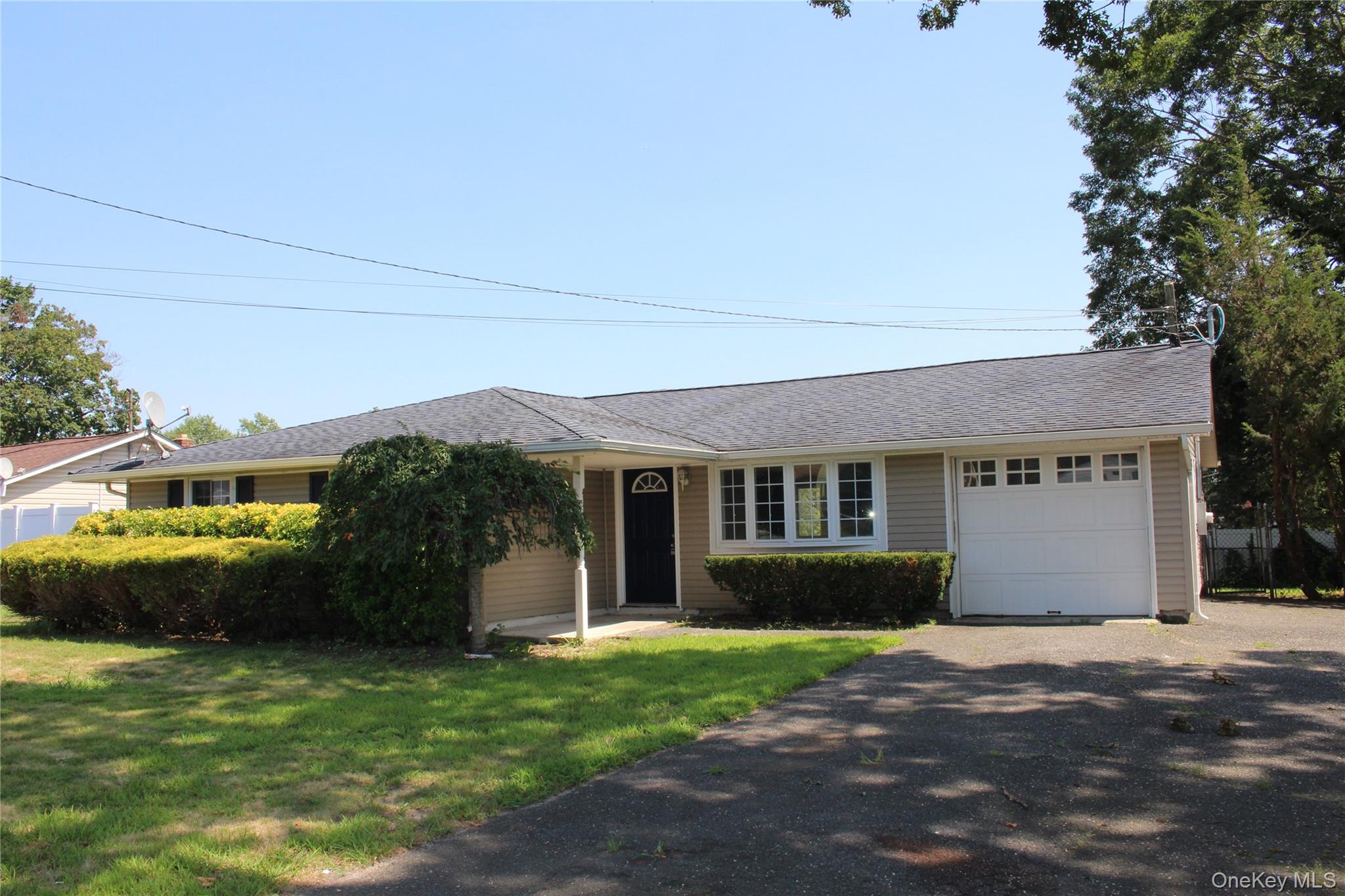 114 Granny Road Farmingville, NY 11738 - Photo 1 of 22 a view of a house with backyard and garden