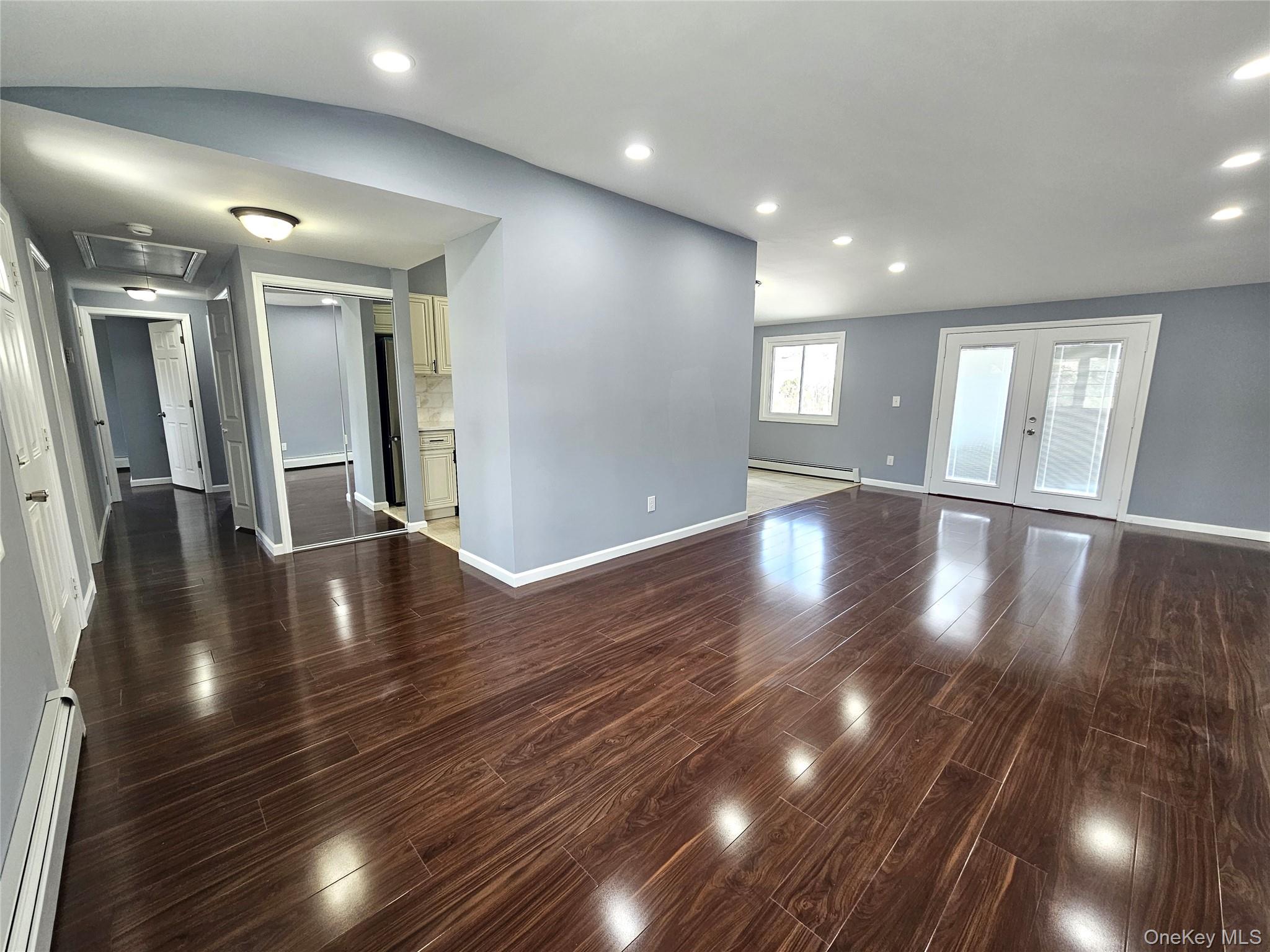 114 Granny Road Farmingville, NY 11738 - Photo 4 of 22 a view of an entryway with wooden floors