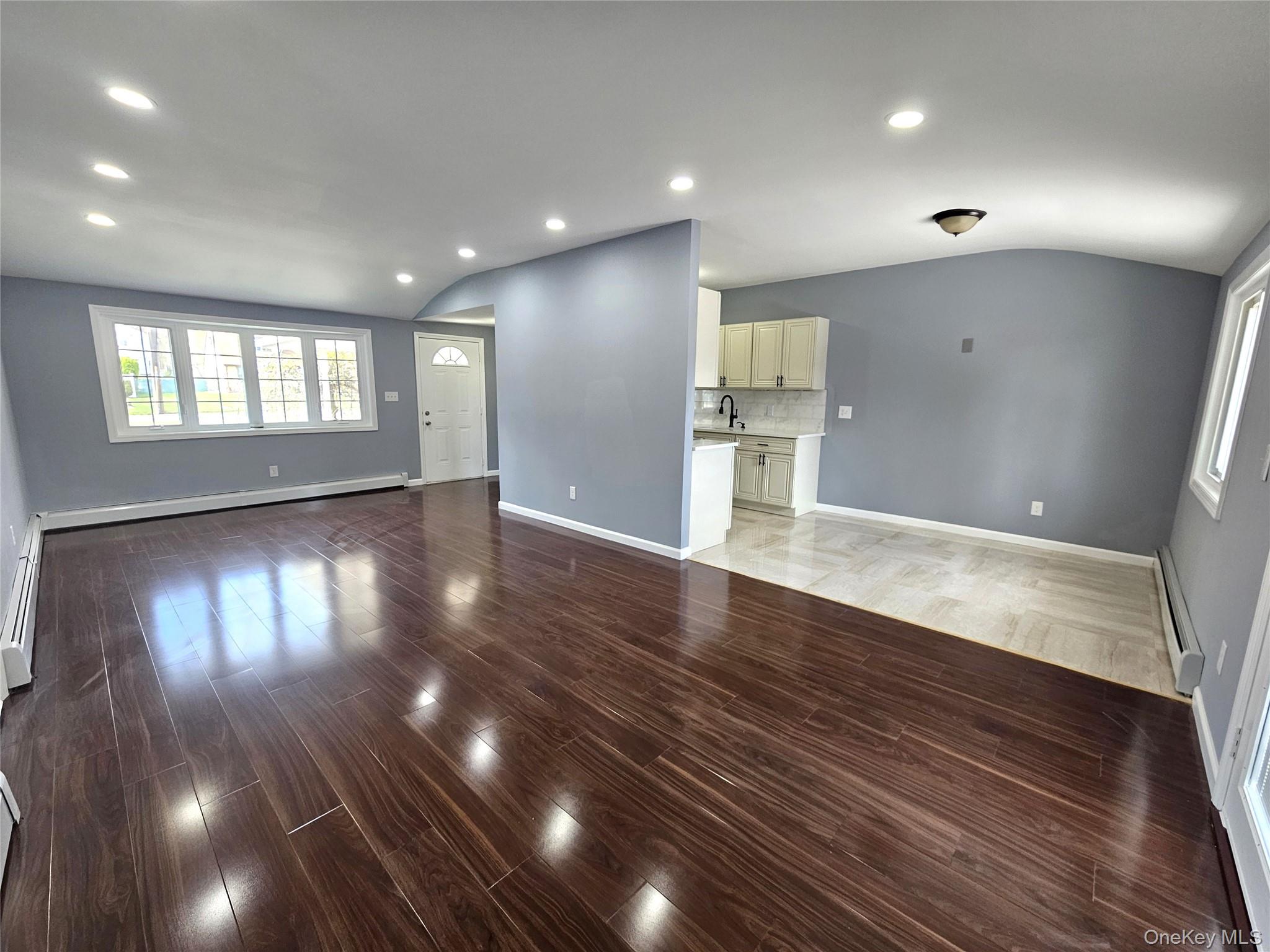 114 Granny Road Farmingville, NY 11738 - Photo 5 of 22 a view of empty room with wooden floor